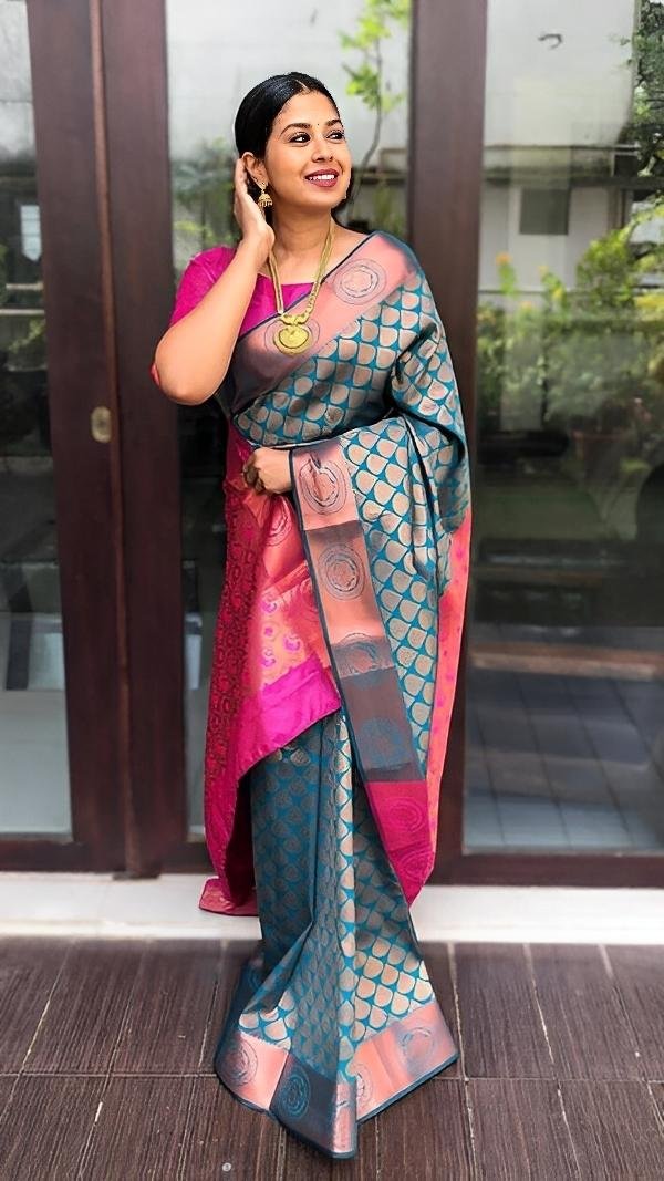 Teal & Rani Pink Banarasi Silk Saree – A Royal Fusion of Colours